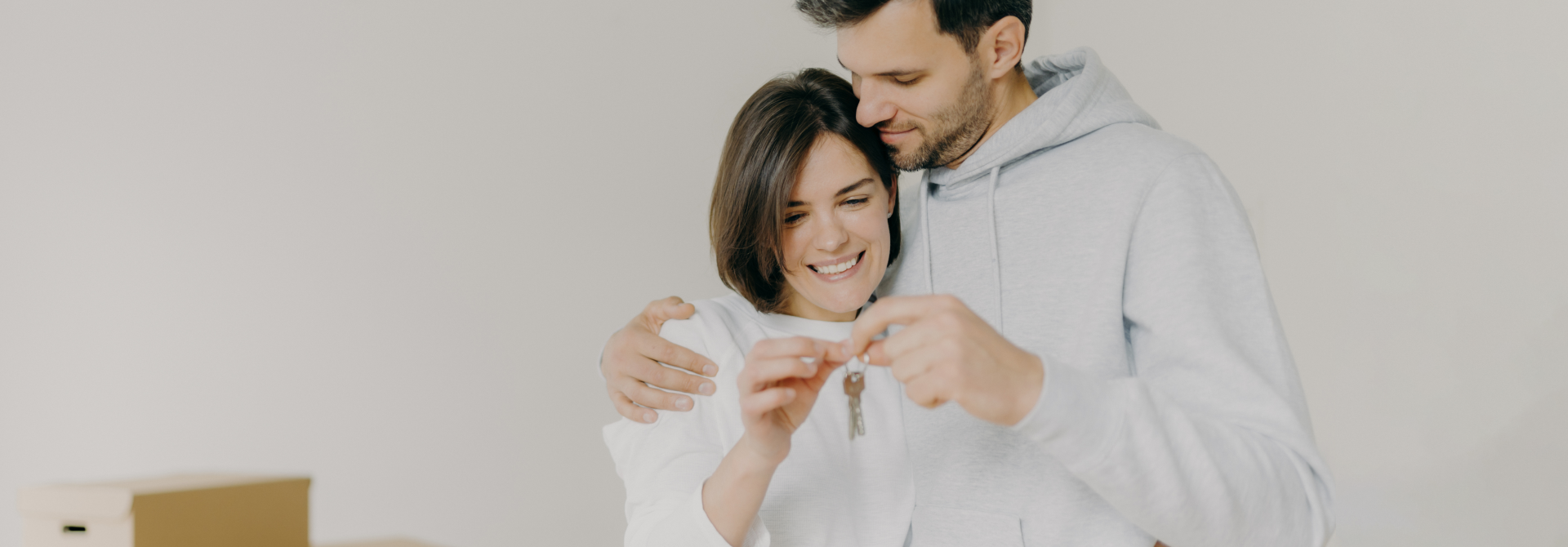 Couple holding house key